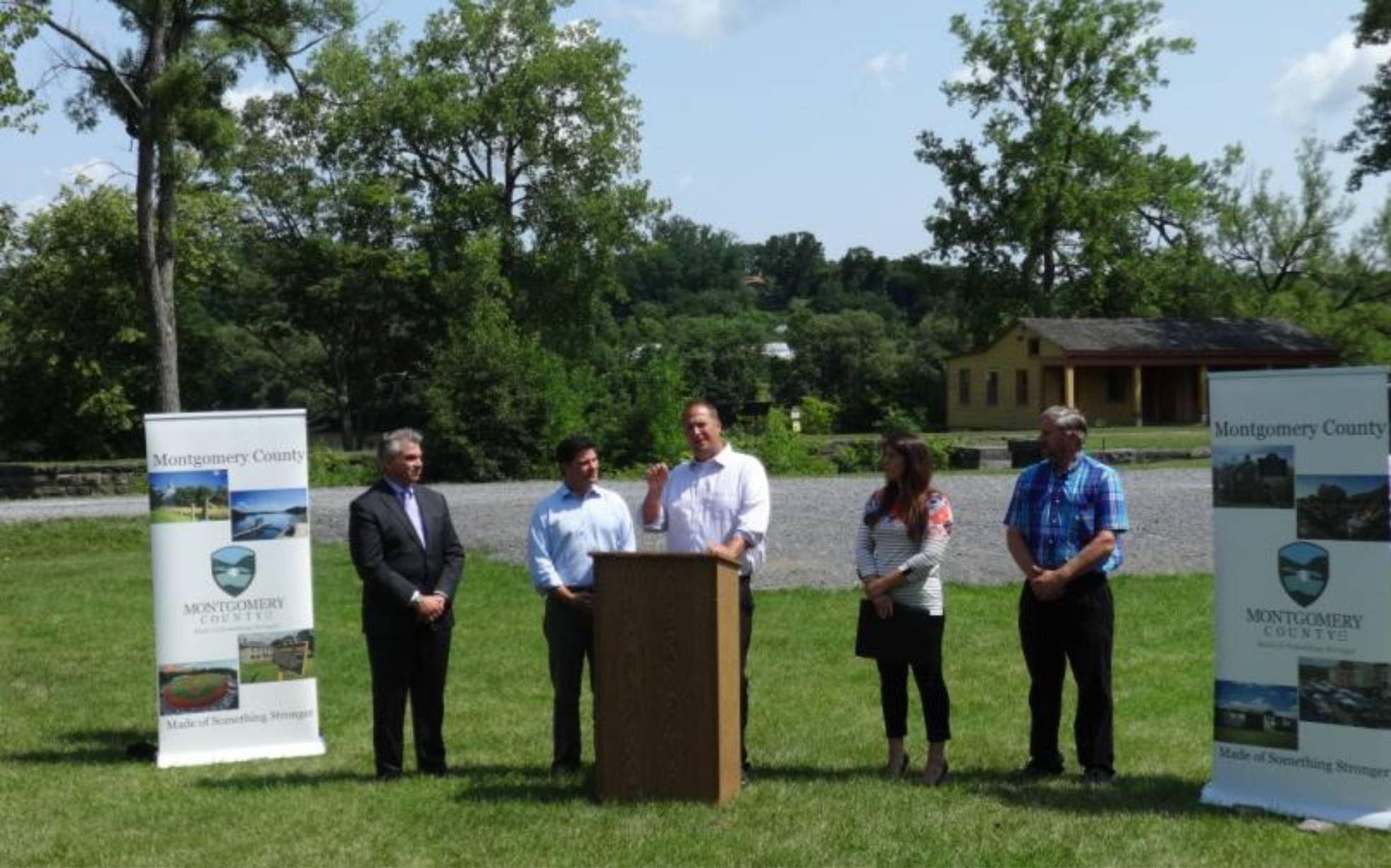 Montgomery County Executive Matthew L. Ossenfort addresses the media and the crowd at an announcement at Yankee Hill Lock.