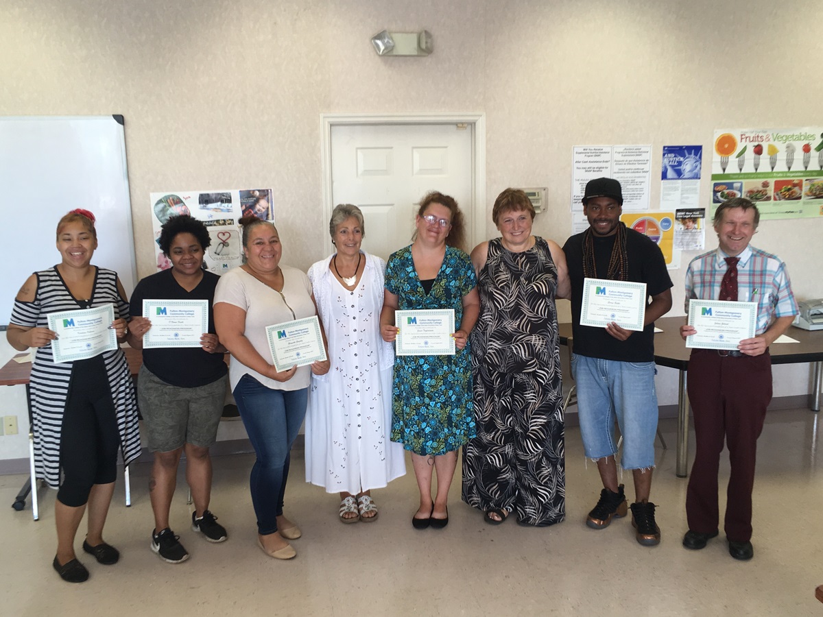 Four participants who concluded the four-week course, along with two other individuals who successfully re-entered the workforce before the course ended and the two course instructors, Heather Loucks and Ellie Fosmire