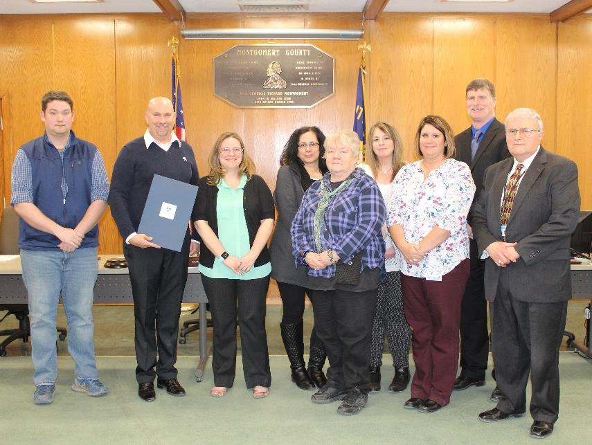 Child Support Unit members receiving an award from the legislature