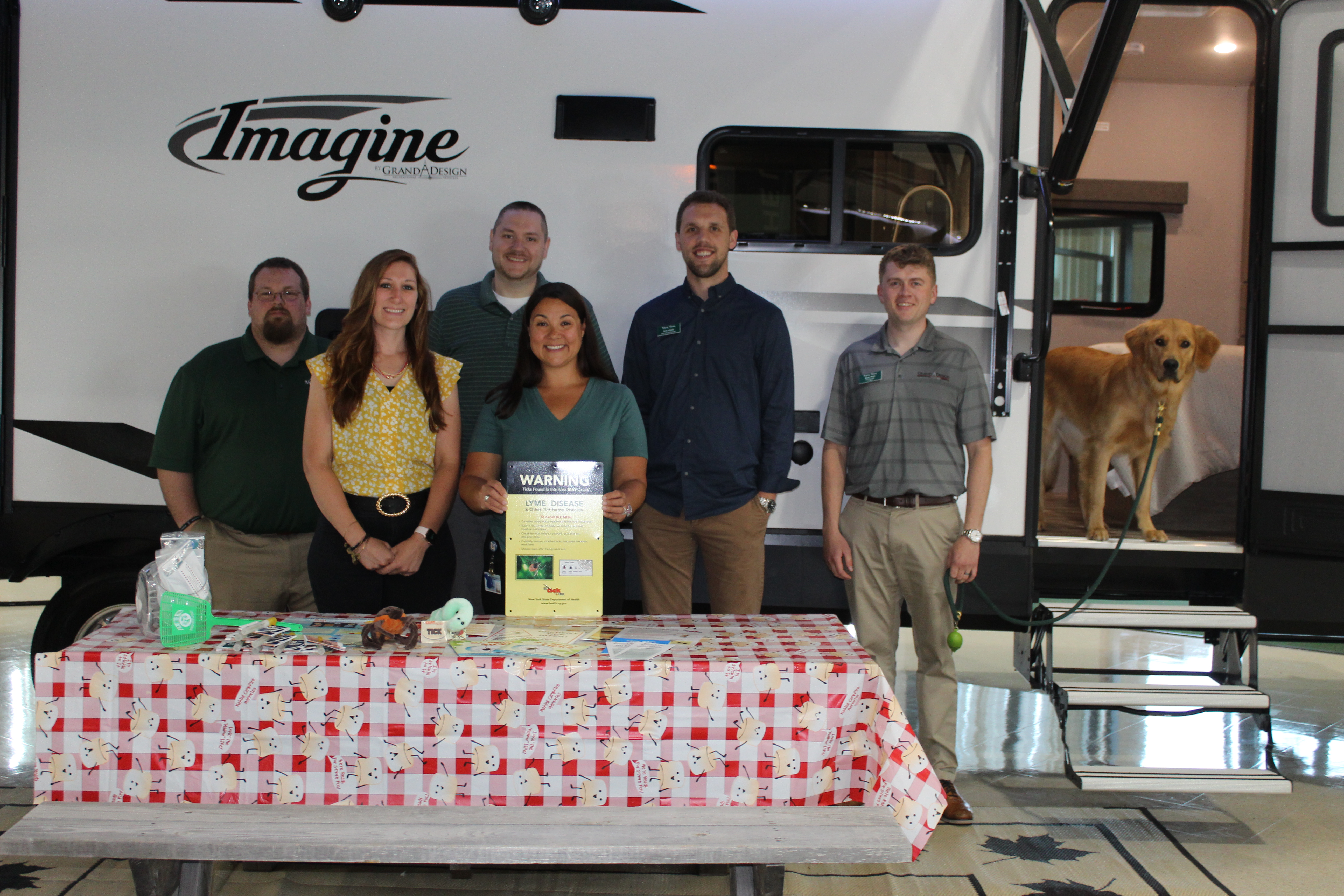 Staff from Montgomery County’s Public Health Department pictured
Friday with Alpin Haus employees after delivering tick kits and Lyme
disease information.