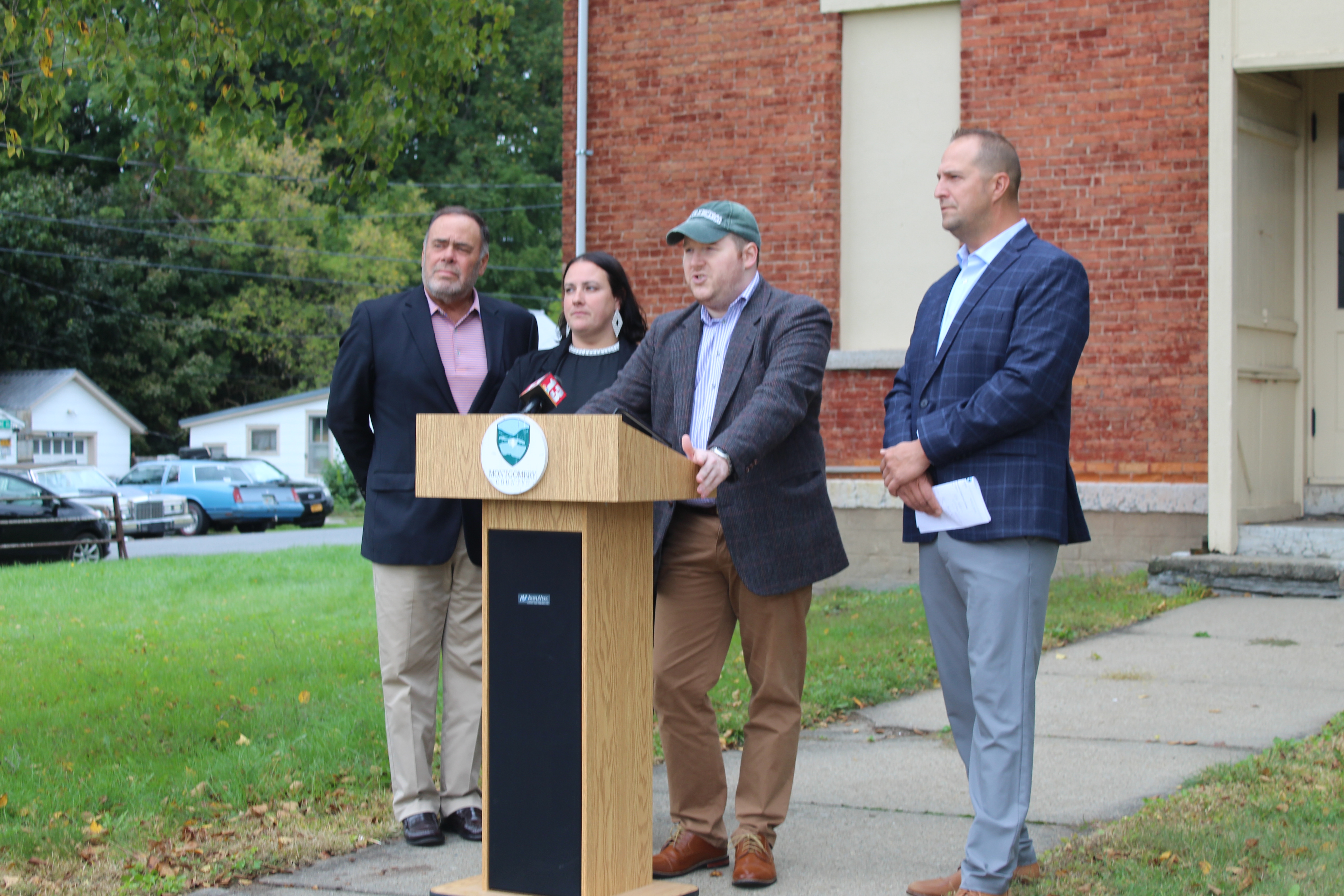 Photo during a press conference announcing funding to revitalize the former Nelliston School.