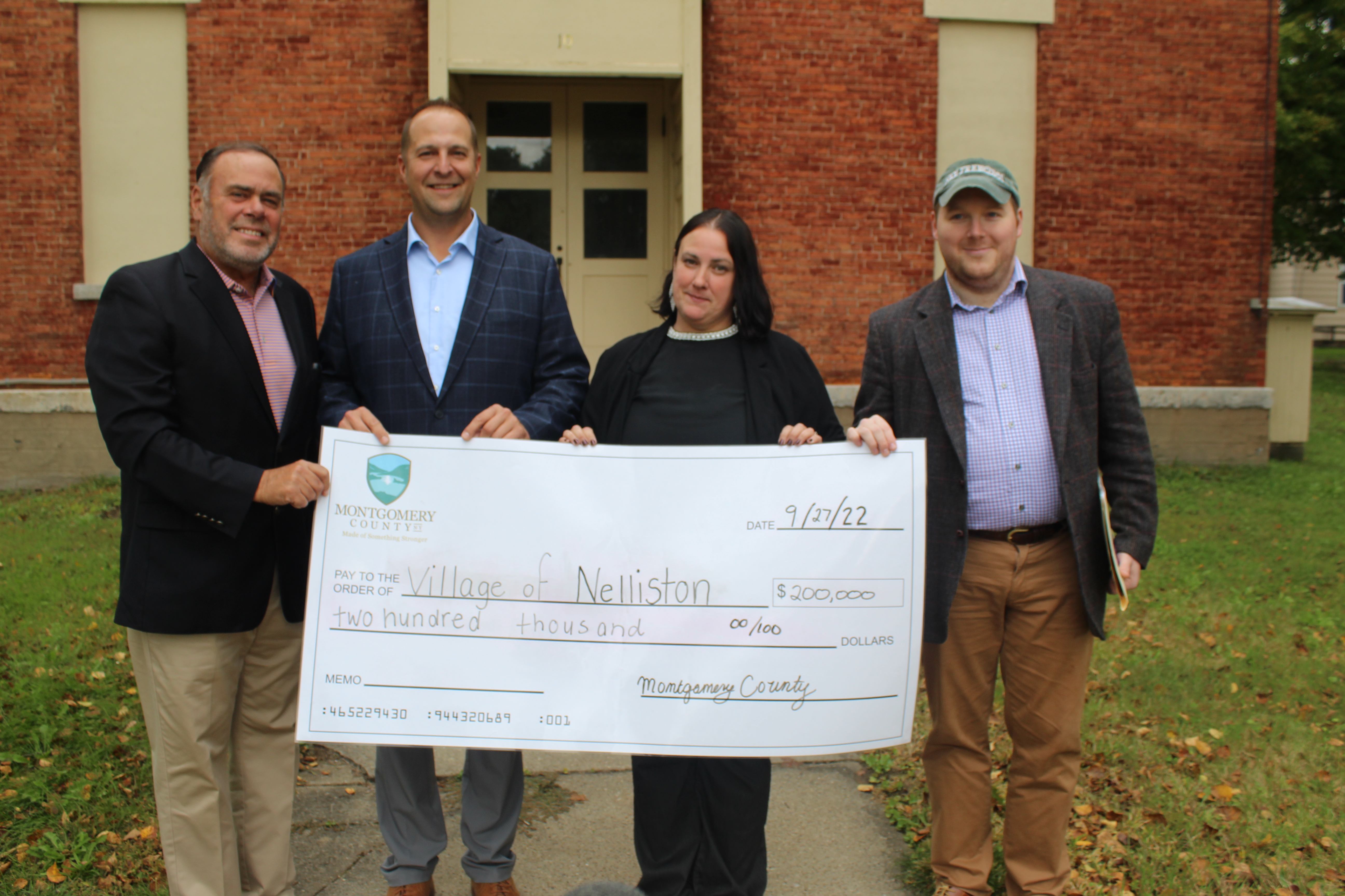 Photo during a press conference announcing funding to revitalize the former Nelliston School.