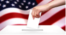 Ballot being inserted into a ballot box, with the American flag in the background