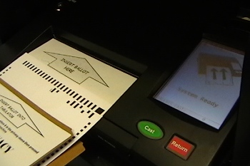 Ballot in privacy sleeve, ready to be inserted into the ballot machine