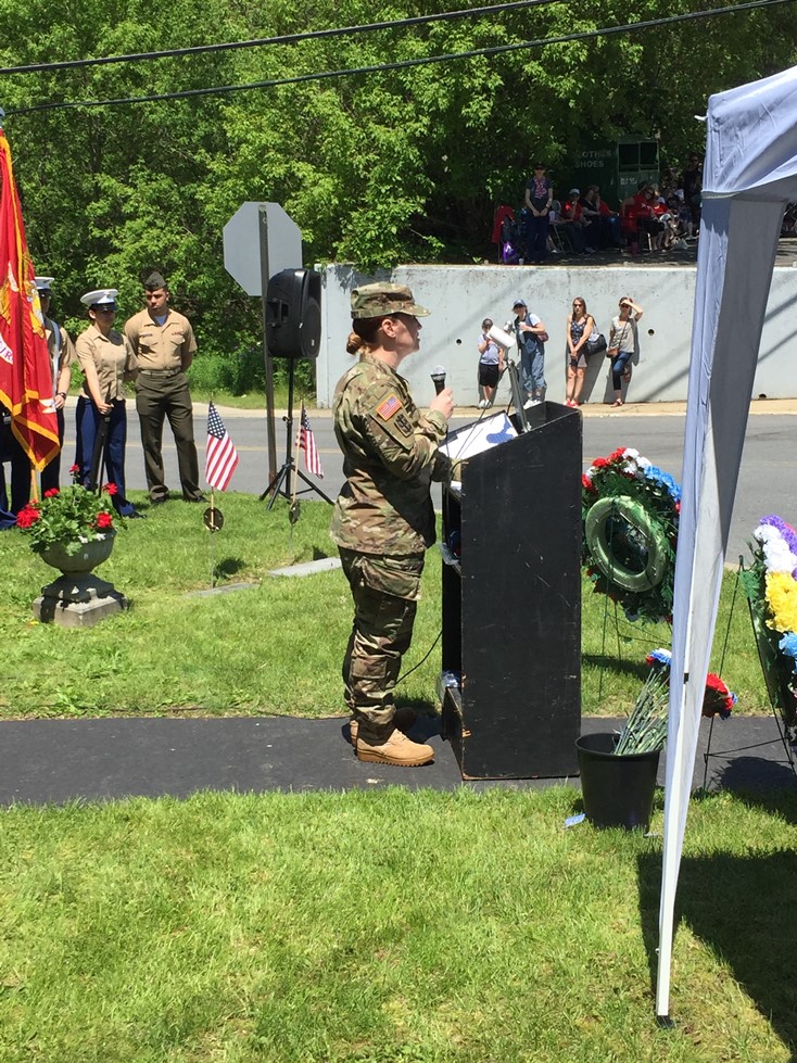 Guest speaker Sarah Secor-Jones speaks at a podium